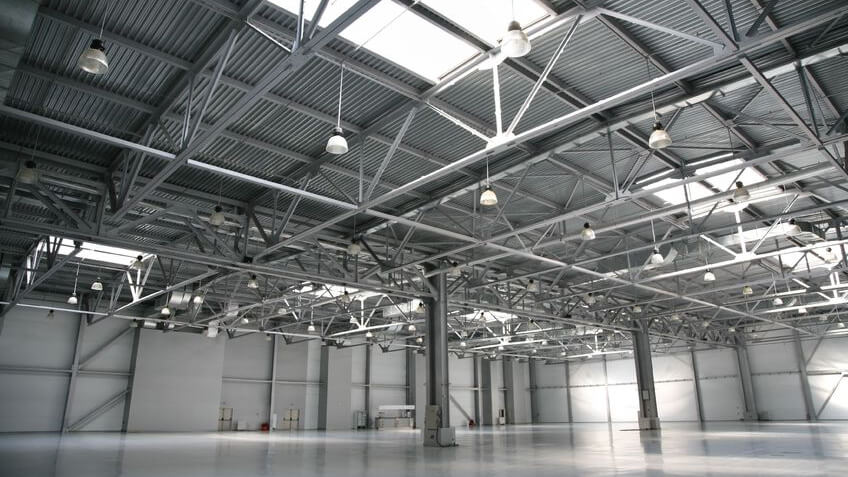 The empty interior of a steel metal building